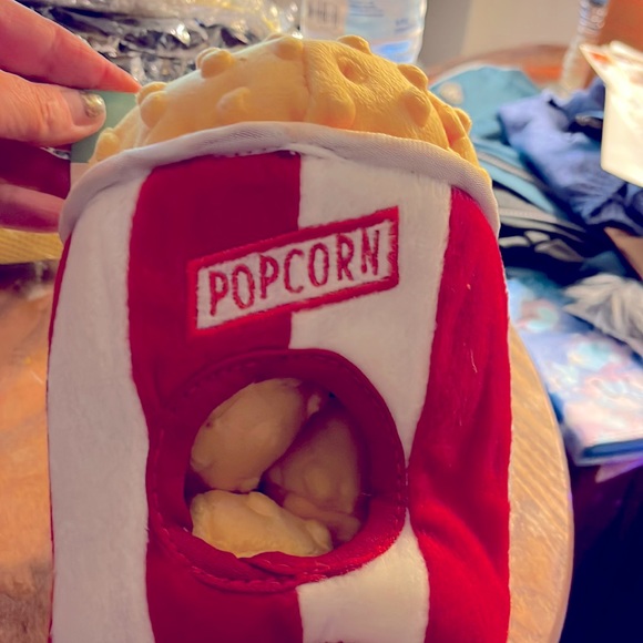 A dog toy with popcorn there is popcorn inside and it keeps them busy - Picture 1 of 2